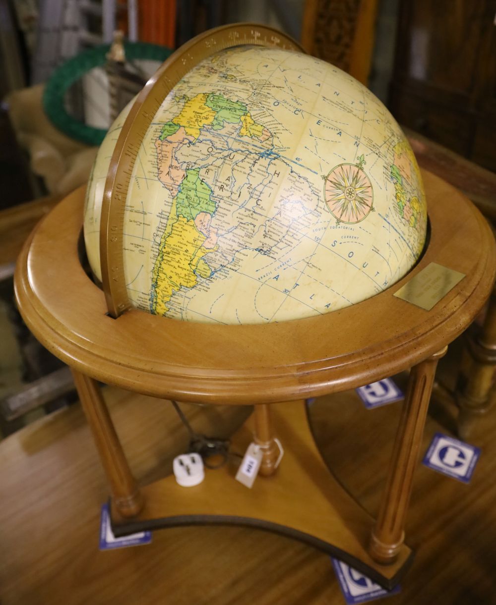 A modern terrestrial globe on wooden stand, height 82cm